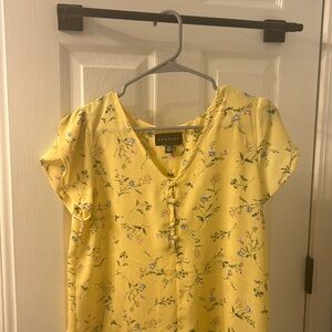 NWOT light yellow floral blouse. Slightly sheer.